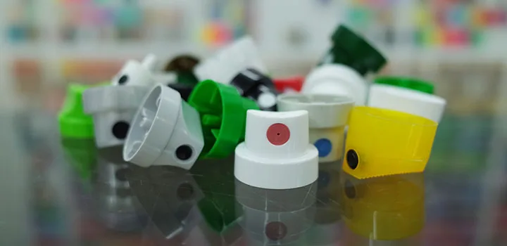 Standard aerosol actuator buttons in various colors